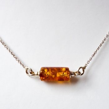 Brown Little Amber Pendant With A Silver Chain