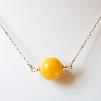Round Yellow Amber Pendant With A Silver Chain