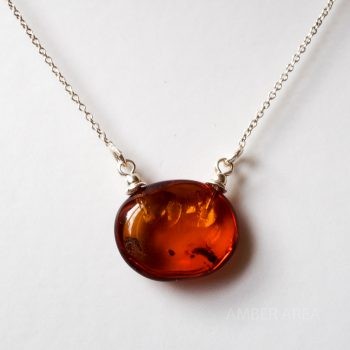 Brown Polished Amber Pendant With A Silver Chain