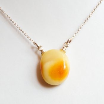 Yellow Brown Amber Pendant With A Silver Chain