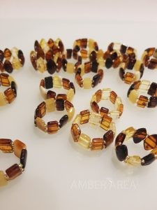Baltic amber rings on rubber wholesale