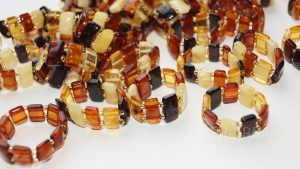 Baltic amber rings on rubber wholesale